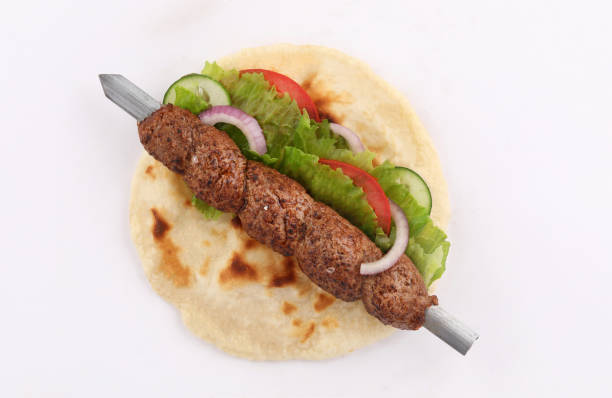 istock Indian shish kofta naan donner kebab sandwich on white background 1190045343
