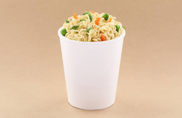 istock Vegetables Noodles cup with fork mockup template for design useson brown background 1190045370