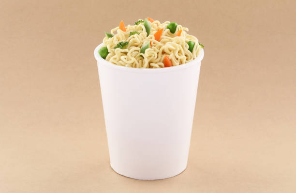 Vegetables Noodles cup with fork mockup template for design useson brown background Vegetables Noodles open cork cup mockup template for design uses isolated on brown background Cup of Pasta stock pictures, royalty-free photos & images