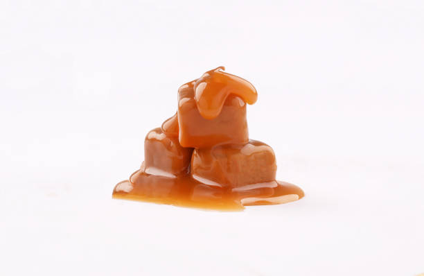 istock piece of sweet caramel on white background 1190045456