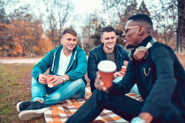 istock Friends Enjoying Coffee During Picnic 1190047912