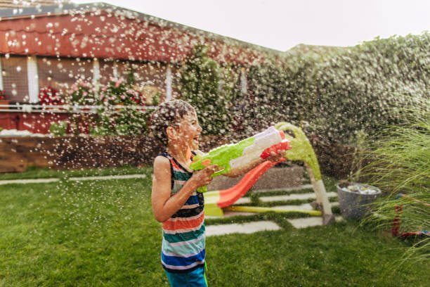 istock Water fight in the yard 1190048292