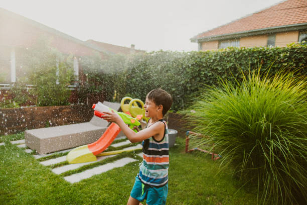 istock Water fight in the yard 1190049313