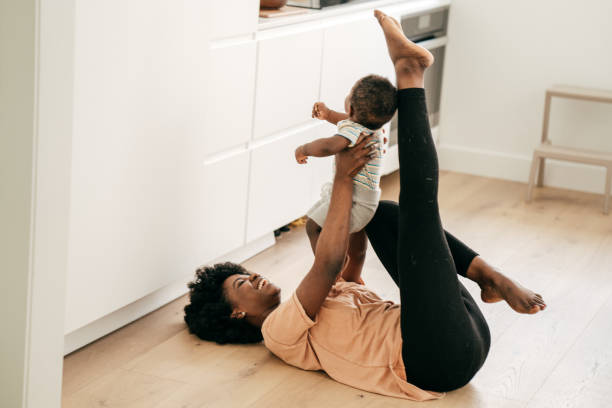 istock Mom playing with baby son 1190049375