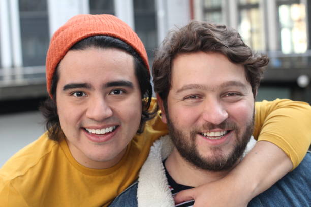 istock Interracial gay couple smiling at camera 1190049512