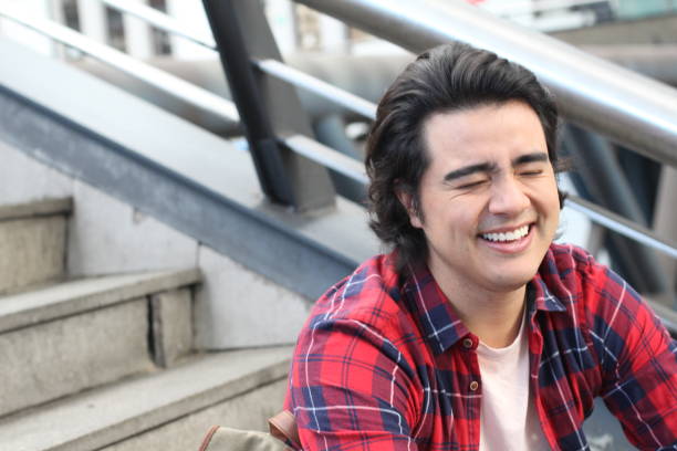 istock Ethnic man laughing with eyes closed 1190049530
