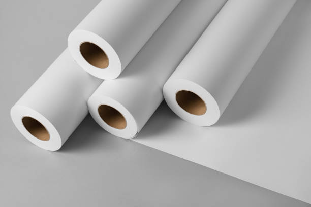 istock Blank white paper rolls mockup isolated on gray background 1190055989
