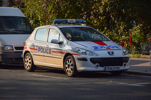 Paris, France - October 3rd, 2014: Police car Peugeot 307 on the street. This model was a popular vehicle on the European market.