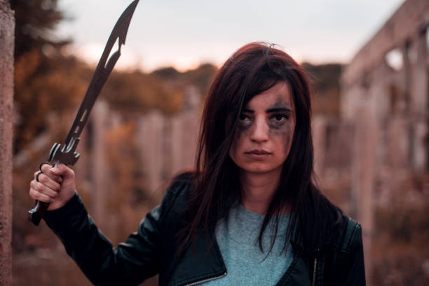 istock Post apocalyptic woman with a sword 1190059015