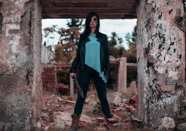 Woman warrior with weapons roaming in post apocalyptic world