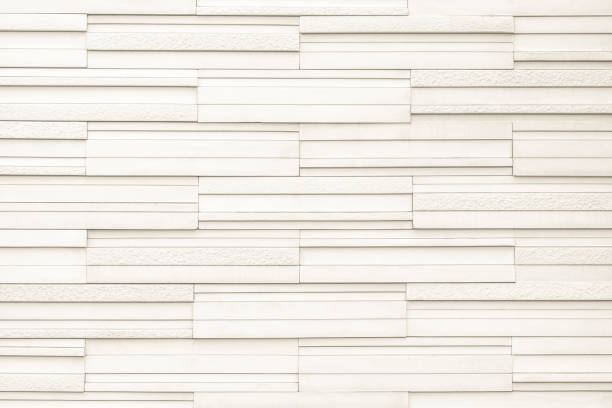 istock Granite tiled wall detailed pattern texture background in natural light creme beige color 1190059328