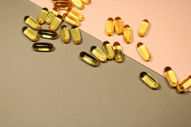 gold omega-3-kapseln - fish oil cooking oil capsule herbal medicine stock-fotos und bilder