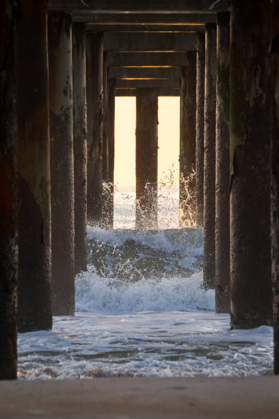 istock Waves crashing under the pier 1190065429