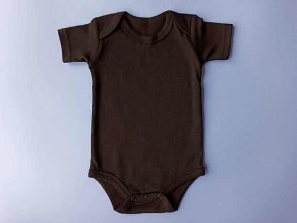 istock Black baby onesie bodysuit mock up on a blue background 1190067367
