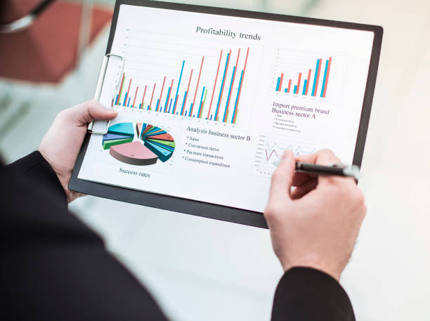 istock businessman working with financial schedule. 1190070914
