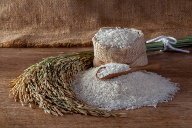 istock Thai jasmine rice in a sack on a wooden background 1190084262