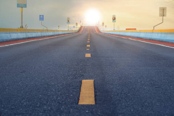 istock sunny sky and beautiful asphalt road 1190084339