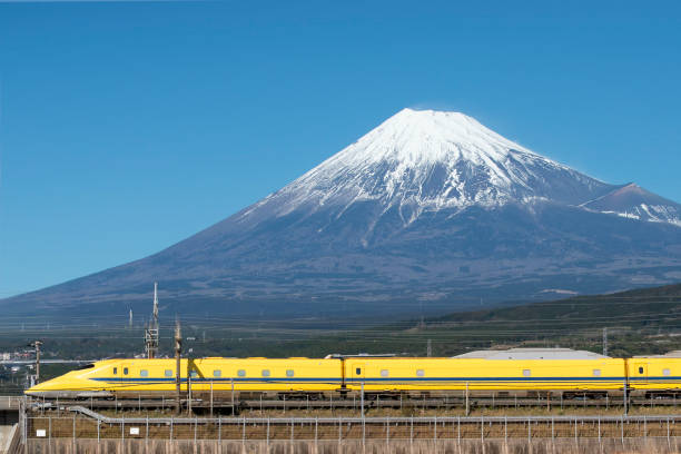 Doctor Yellow Shinkansen and Fuji Mountain Japan - January 15, 2019 : Doctor Yellow Shinkansen run pass Fuji Mountain background in Winter,Fuji City, Shizuoka bullet train mount fuji stock pictures, royalty-free photos & images