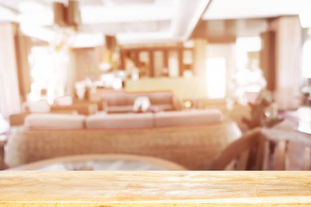 istock Empty wooden table blurred of restaurant cafe background and reception room, can be used for display or montage your products 1190085521