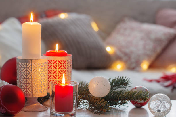 istock Christmas decora with candles and balls on white table indoor 1190086124