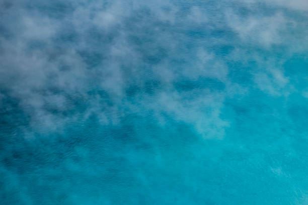 Blue Geyser with Smoke on the Surface