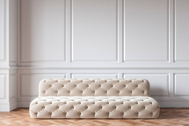 istock Classic white interior with capitone chester sofa, mouldings, wooden floor. 3d render illustration mock up. 1190093165