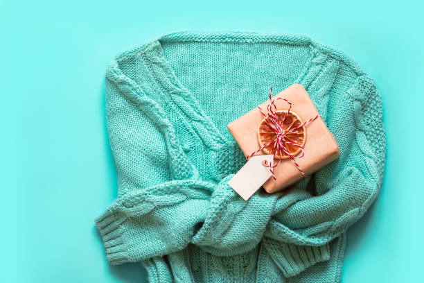 istock Mint Green pullover with with christmas gift zero waste decorated. Holiday concept 1190096552