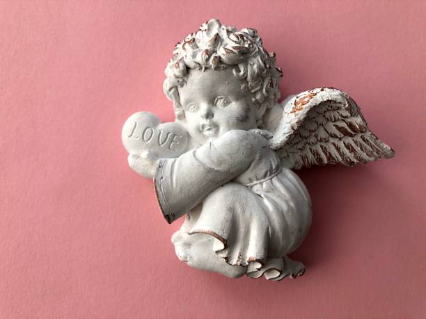 istock little angel on a pink background 1190099775