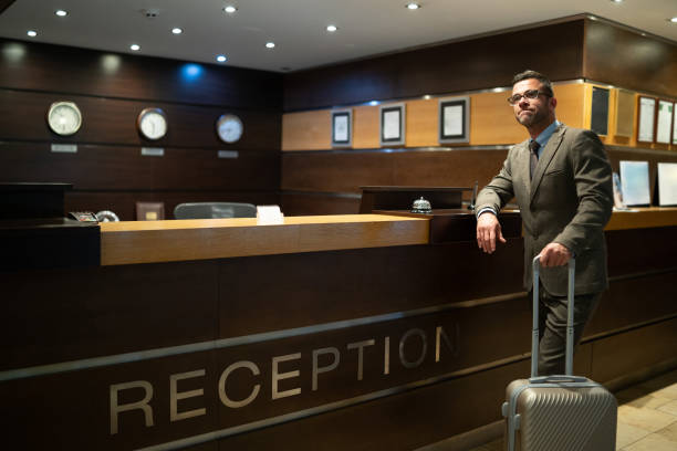 istock Bored businessman waiting on hotel's reception 1190100519