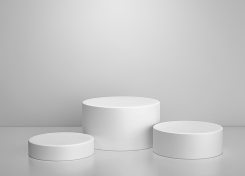 White cylinder podium, product display stand on gray background. 3D rendering