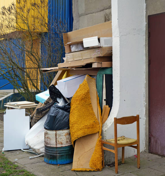 istock Cardboard boxes and old  broken furniture at the garbage dump 1190102942