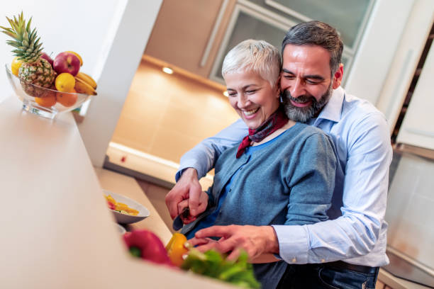 istock Mature couple enjoying in their kitchen 1190105126