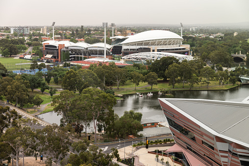 Adelaide, Australia - October 19, 2019: Aerial view of River Torrens featuring Adelaide Oval and Adelaide Convention Centre at midday