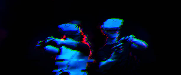 istock Couple with virtual reality headset are playing game. Image with glitch effect. 1190108075