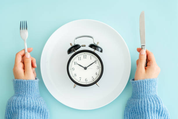 Meal planning for diet concept Blue, Breakfast, Clock, Concepts, Plate fasting stock pictures, royalty-free photos & images