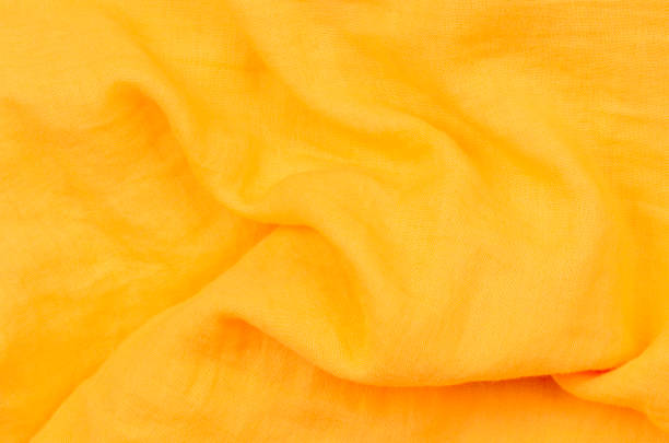 istock close up crumpled orange cotton fabric background 1190118774
