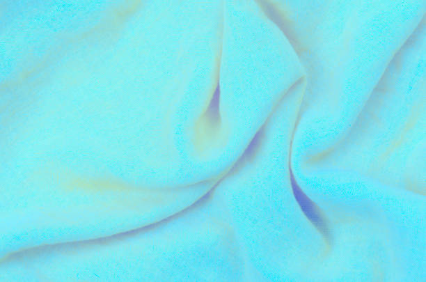 istock close up crumpled blue cotton fabric background 1190118792