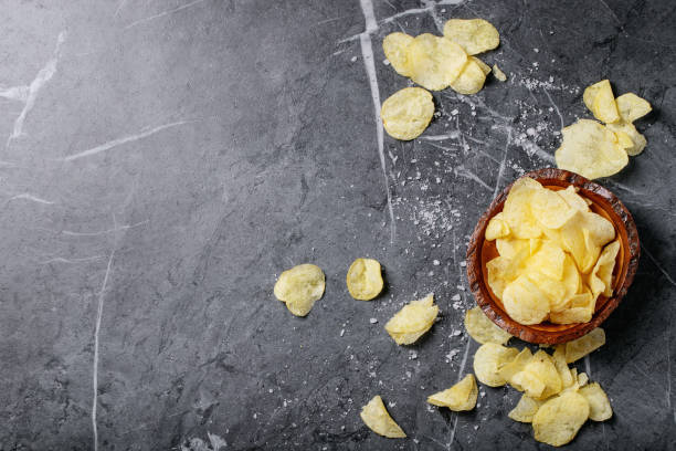 istock Bowl of home made potato chips 1190119967