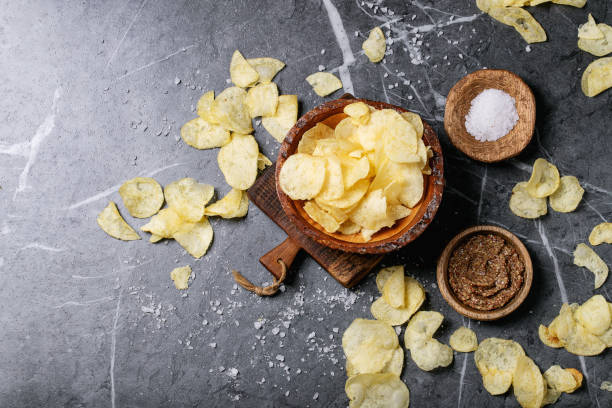 istock Bowl of home made potato chips 1190119987