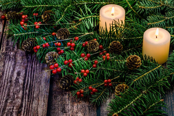 istock Decorated christmas tree branch on wooden table 1190121560