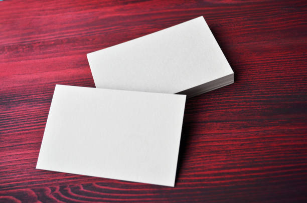 istock Empty white Business Card on red background 1190122130