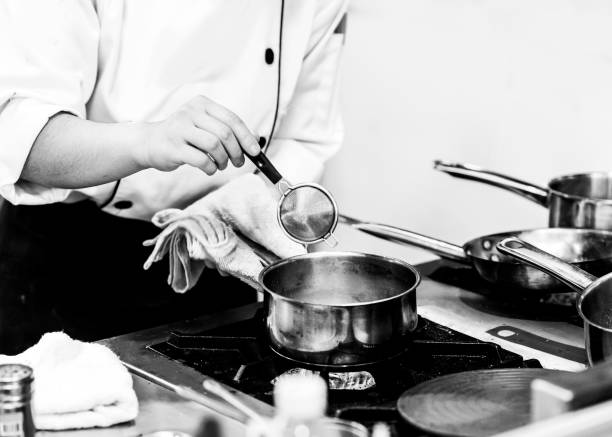istock Chef preparing food, meal, in the kitchen, chef cooking, Chef decorating dish 1190122318