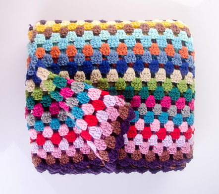 blanket or crochet blanket on a background new