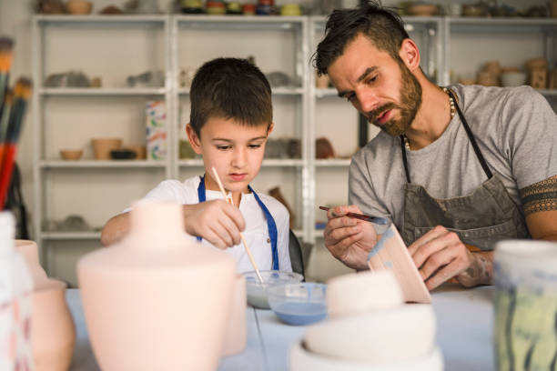 istock Artistic family painting pottery 1190123854