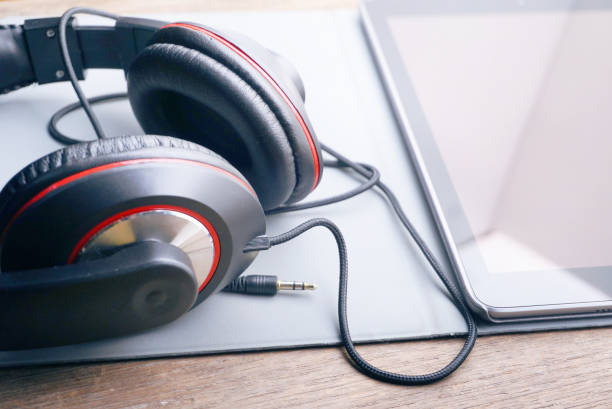 istock Headphone and tablet on wood table,lifestyle concept. 1190124564