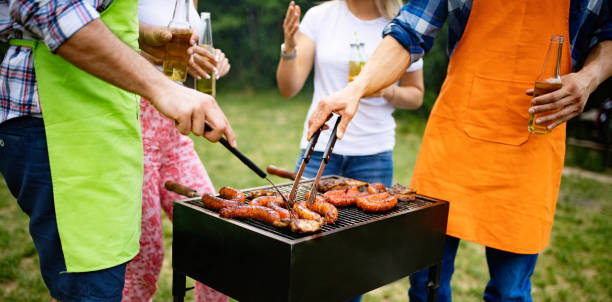 istock Friends having fun in nature doing bbq 1190125549