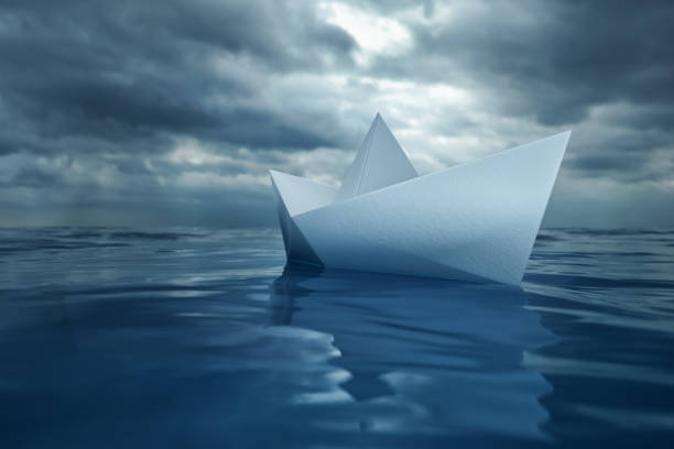 istock Paper Boat on Sea 1190125865