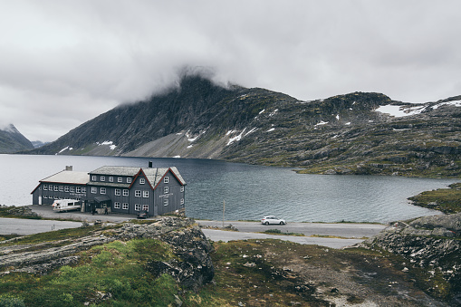 Djupvatnet, Norway - August 2017: view over Djupvasshytta hotel, lake and moutains on cloudy day.