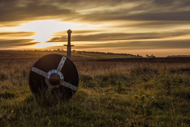 Sword in the stone at dawn Sword in the stone at dawn in the beautiful countryside landscape in the north of England on a beautiful day in September excalibur stock pictures, royalty-free photos & images