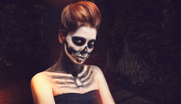 istock Woman with skull makeup 1190129476